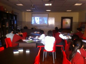 Grade 7 watching movie based on WWII